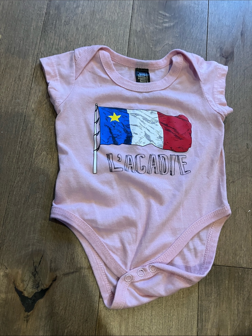 L'Acadie Soft Pink Baby Bodysuit with Flag Graphic
